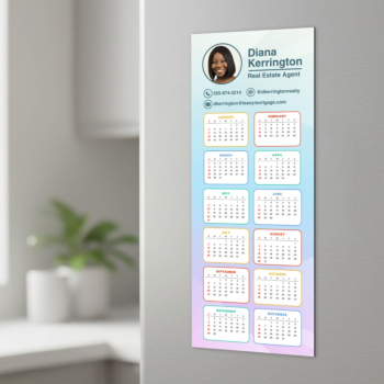 Custom calendar magnet with full-year grid and realtor contact information on a wall