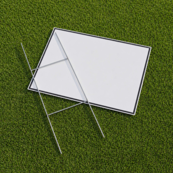 Metal H stake positioned with a corrugated yard sign on grass for yard sign installation