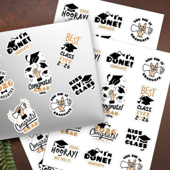 Graduation sticker sheets with multiple die cut graduation designs spread across a laptop and dark surface showing full sheet layout