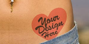 A heart shaped temporary tattoo applied on the hip of a girl just above the pants line and below her bellybutton. 
